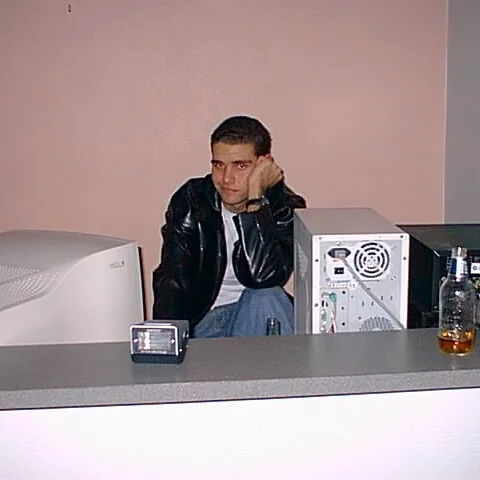 Sean behind an early desktop computer and monitor in Brisbane in 2000.